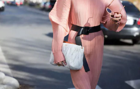 Model walking down street